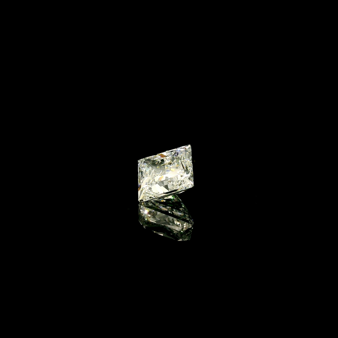 A 1.5 ct. Princess Cut Lab Grown Diamond reflecting on a black surface.