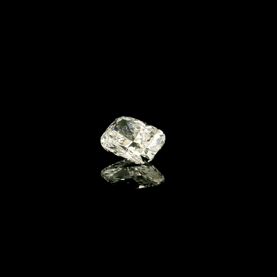 A 2 ct. Elongated Cushion Cut Lab Grown Diamond reflecting on a black surface.