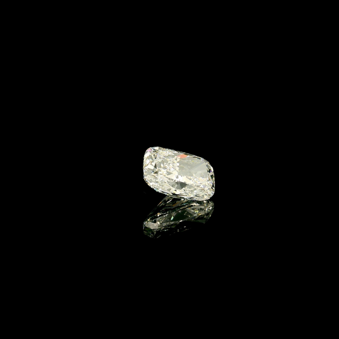 2 ct. Elongated Cushion Cut Lab Grown Diamond reflecting on a black surface.