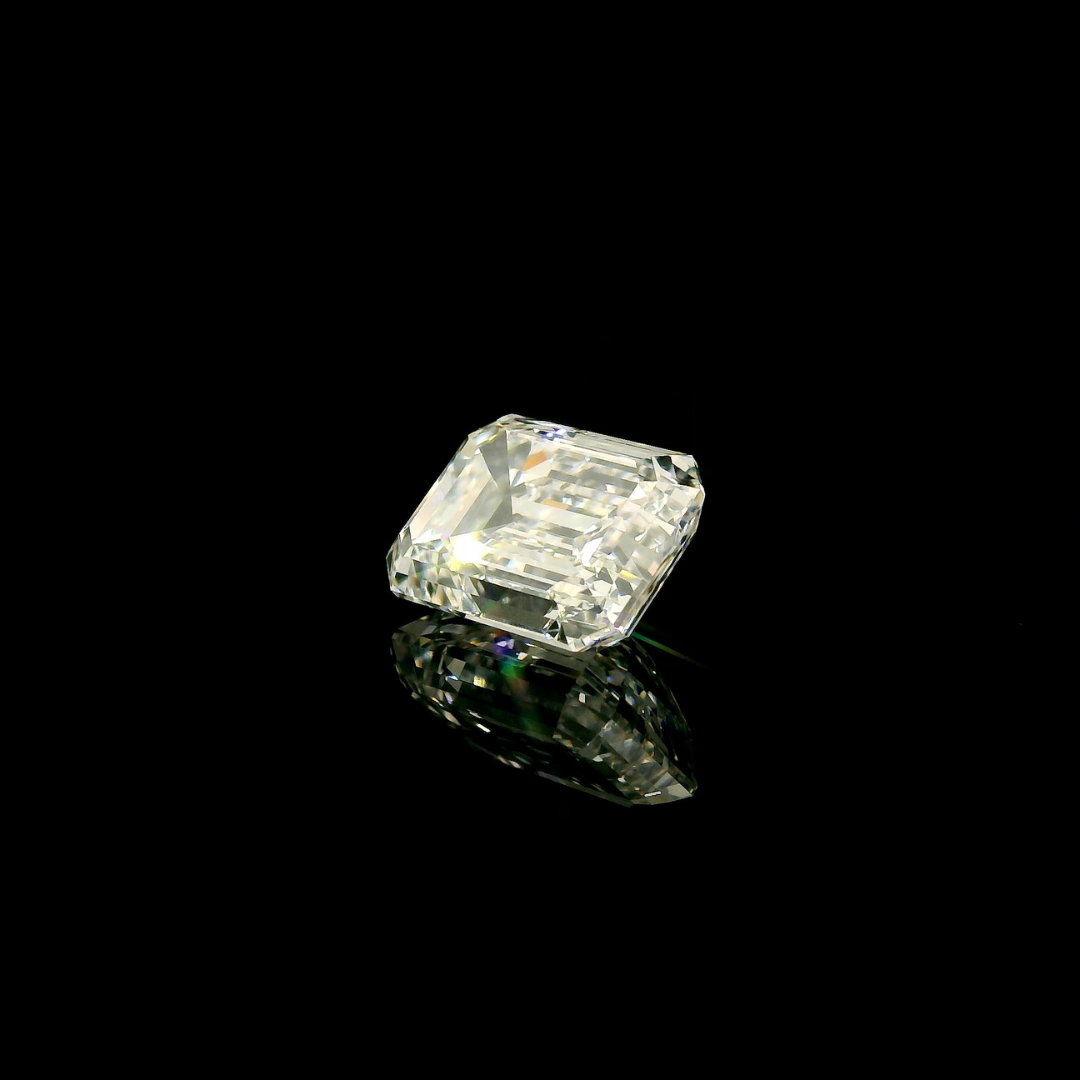 A 3 ct. Emerald Cut Lab Grown Diamond with a clear, reflective surface set against a black background.