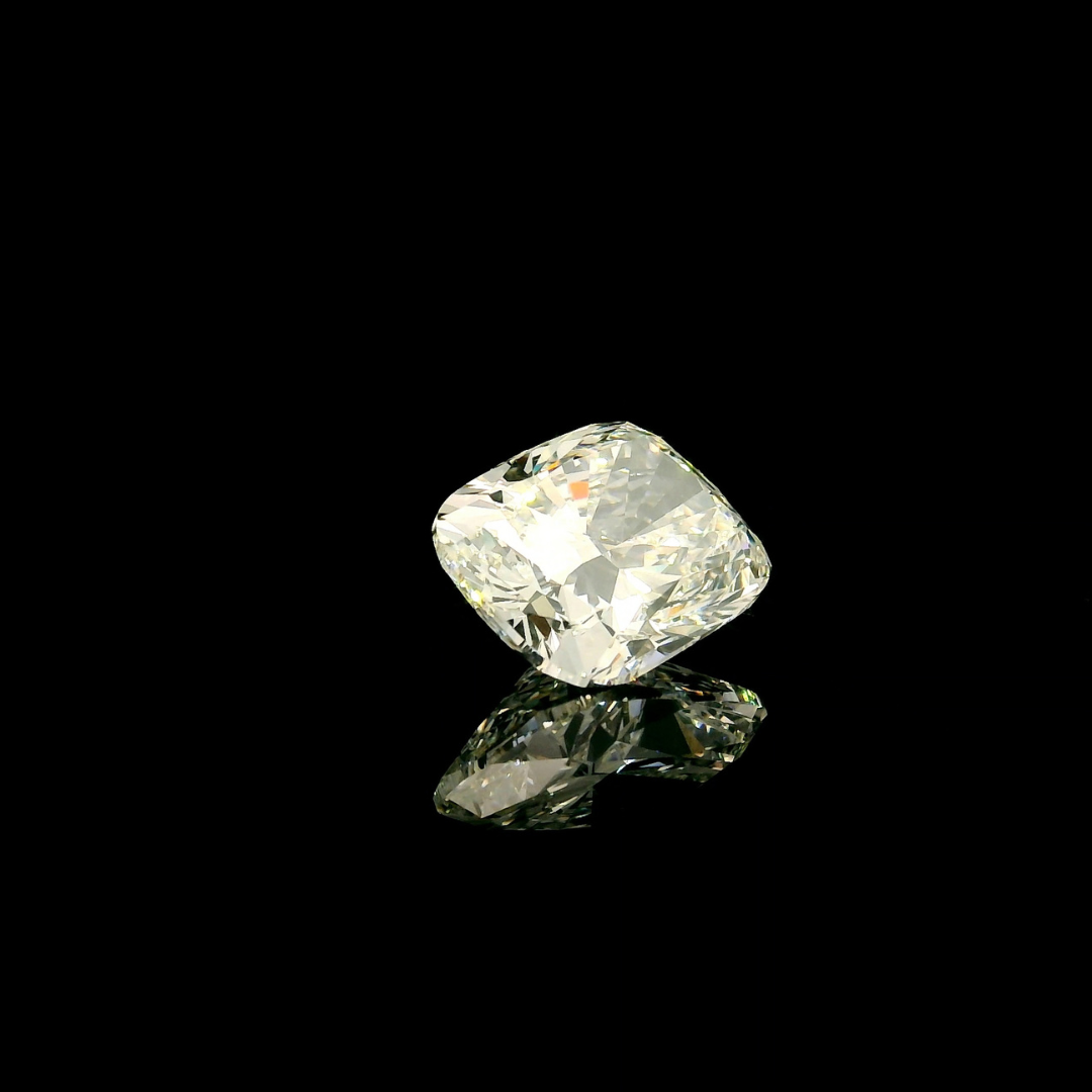 A 4 ct. Elongated Cushion Cut Lab Grown Diamond with a reflective surface set against a black background.