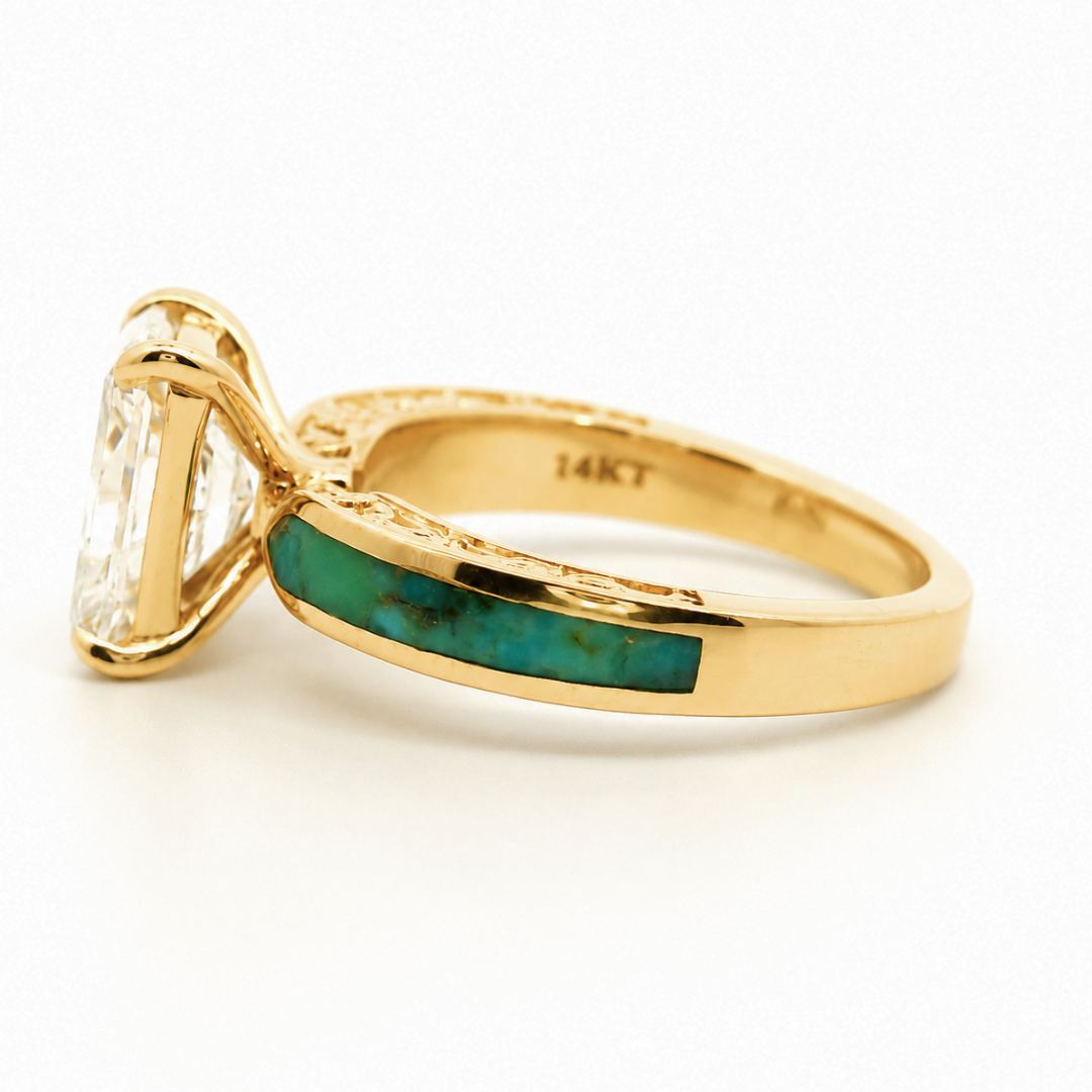 Certainly! Here’s the revised sentence using the given product data: The Diamond Rochelle is a gold ring featuring a large clear lab-grown diamond gemstone and an inlaid turquoise stone on the band, which is engraved with 14KT.
